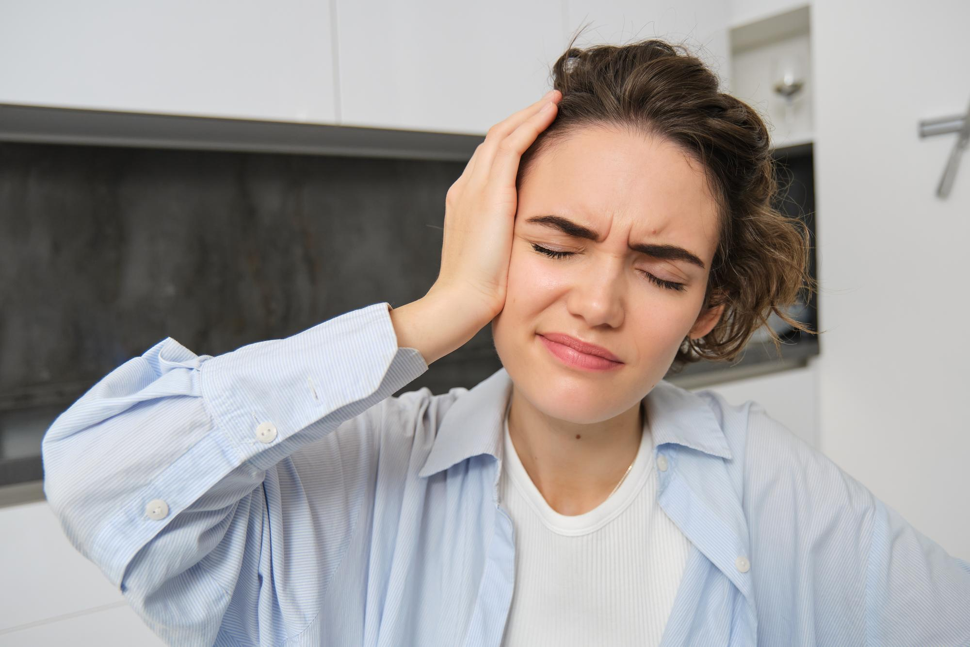 Kopfschmerzen als mögliches Symptom einer Craniomandibulären Dysfunktion